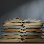 Pile of similar opened books
